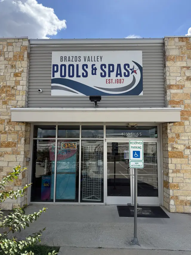 The Brazos Valley Pools & Spas storefront and EST. 1987 sign at 4160 SH 6 S